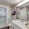 Model bathroom at our apartments for rent in Flower Mound, TX, featuring white countertops and a walk in closet.